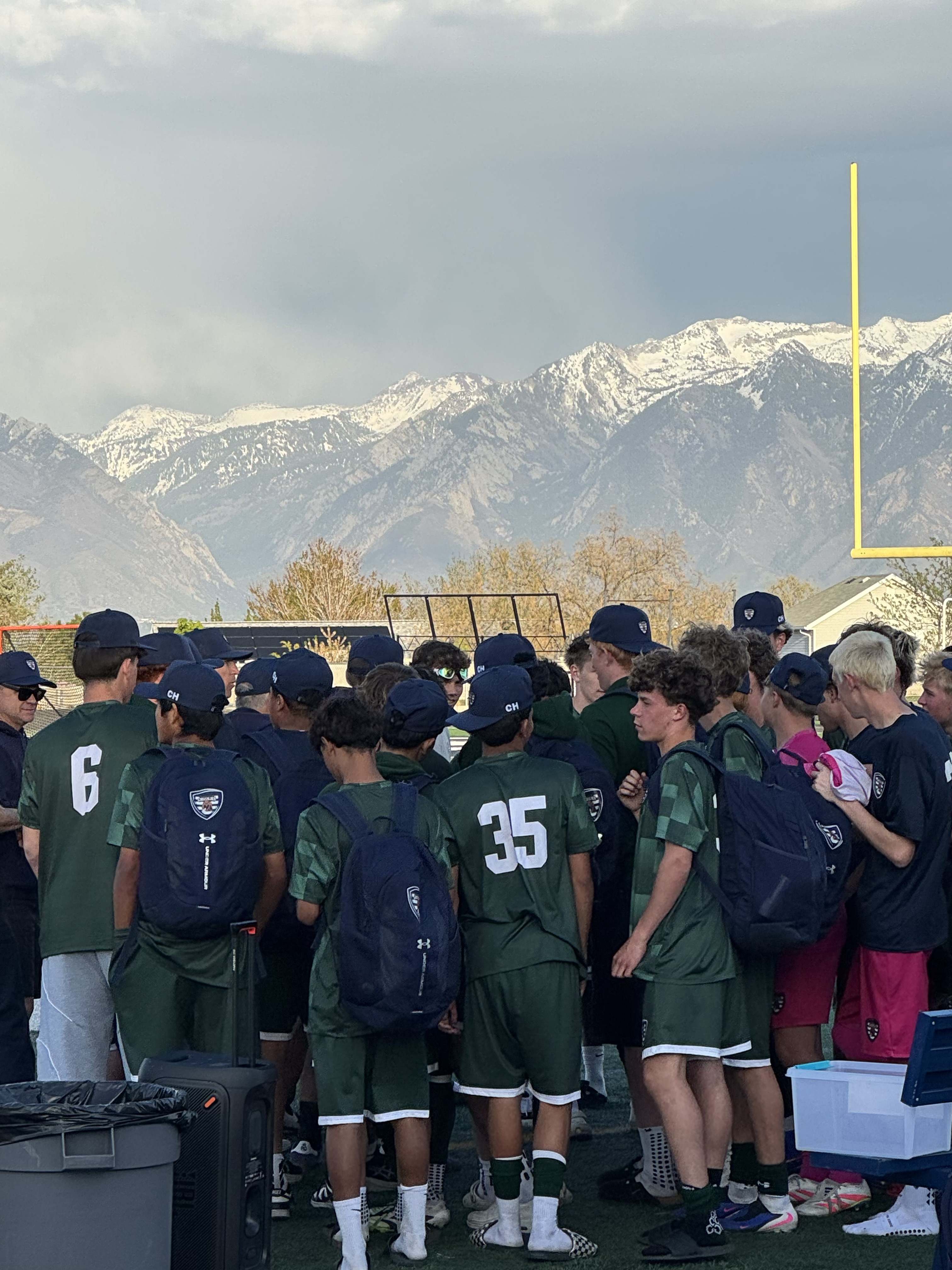 A team proudly wearing their custom Kuvaa hats together